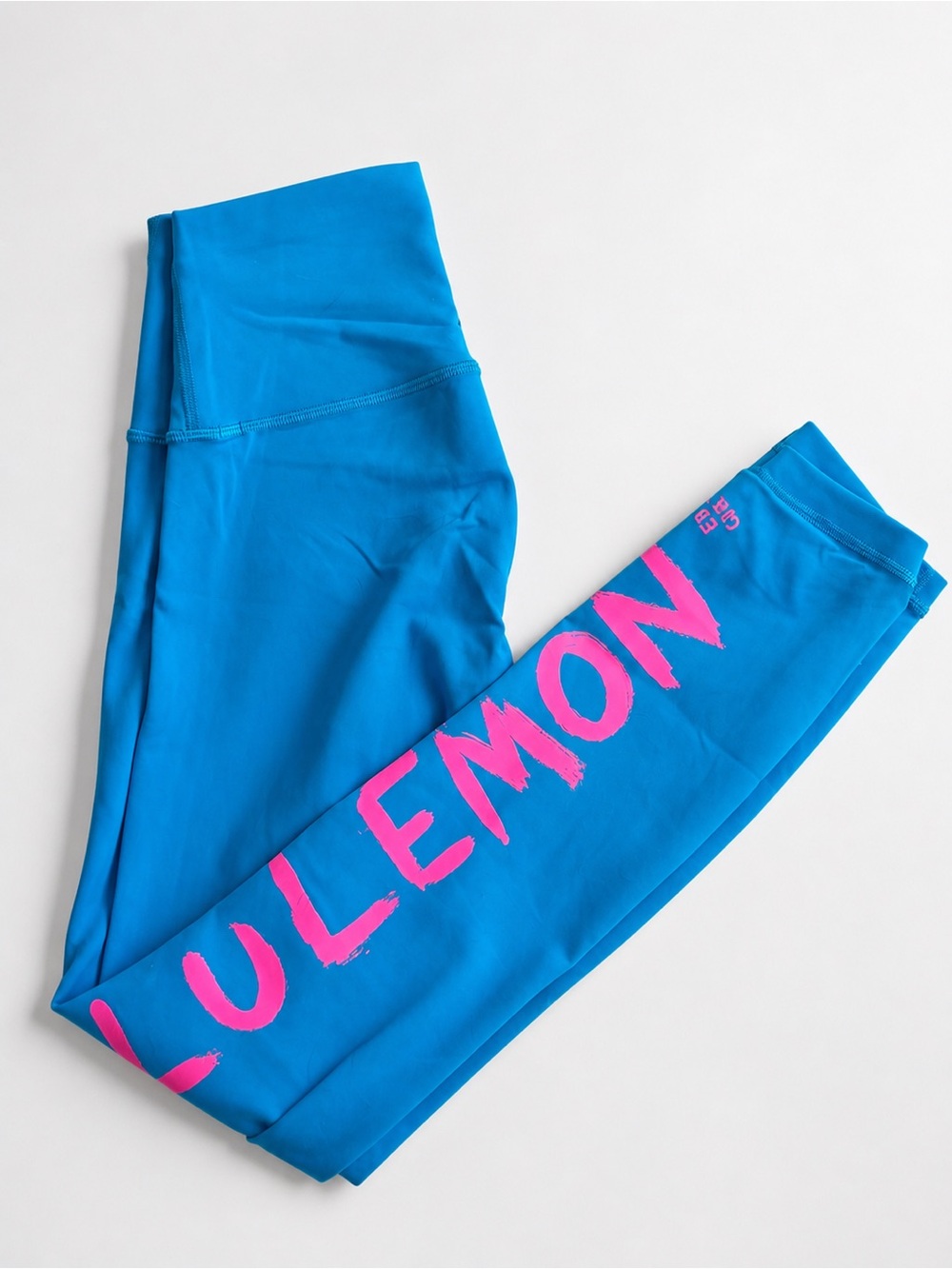 Lululemon Bright Blue Leggings with Hot Pink Logo